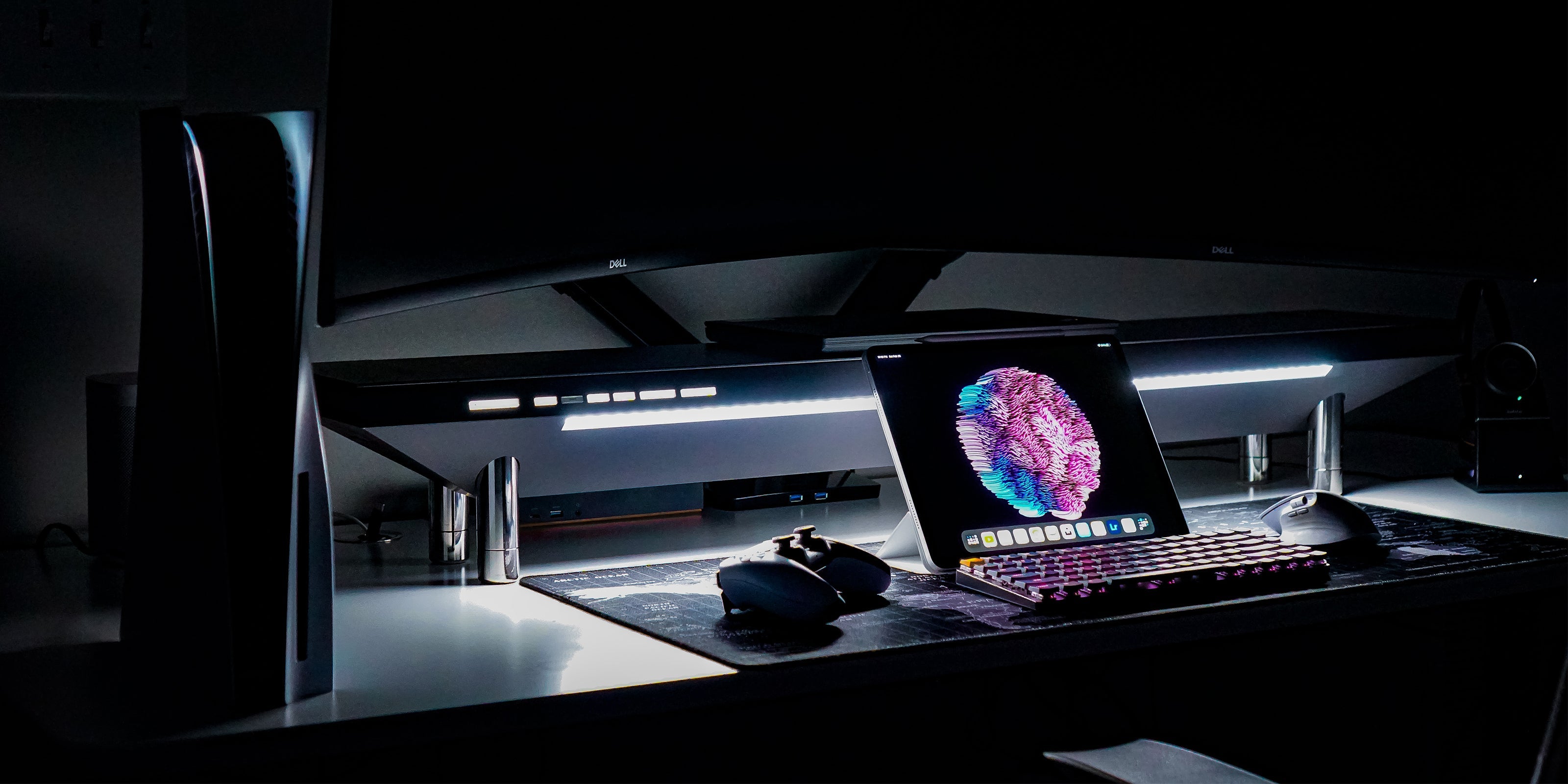 Monitor, mini pc and gamepad on the table
